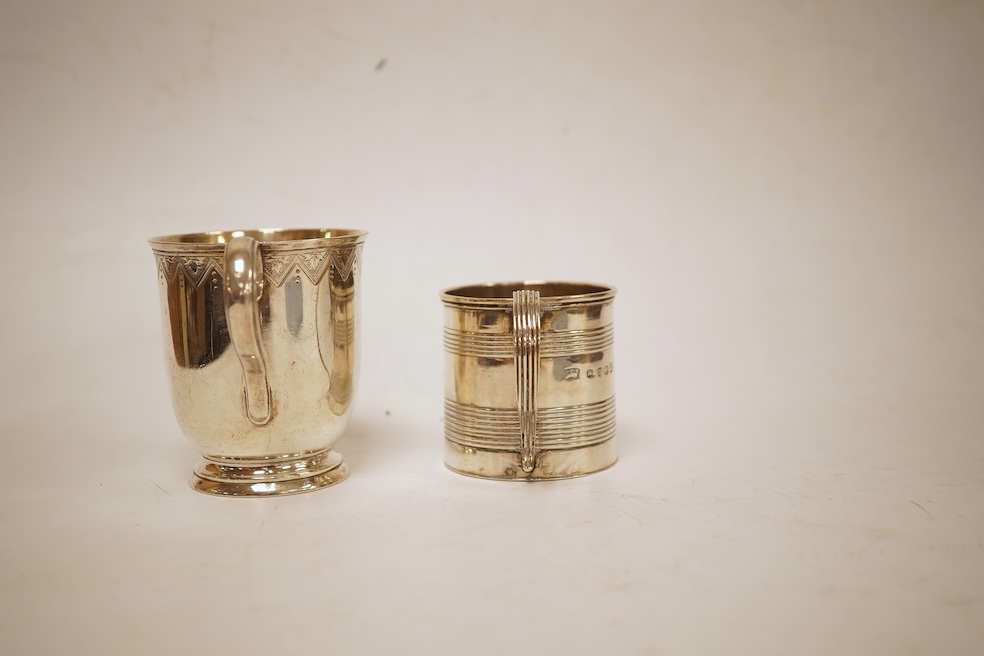 A small late George III reeded silver christening mug, London, 1818, height 51mm, together with a later Victorian silver christening mug, Arthur Sibley, London, 1764.